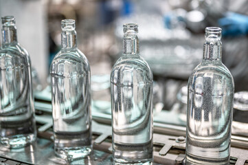 Bottles of luxury vodka on automated production line
