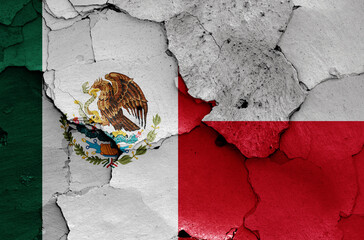 flags of Mexico and Poland painted on cracked wall