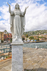 Statue of Santa Margherita praying for the safe return of fishermen facing the sea at Tigullio Gulf...