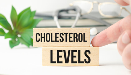 cholesterol levels text on wooden blocks and stethoscope - obrazy, fototapety, plakaty
