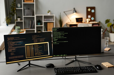 Background image of two computers at workplace with code lines on screen in IT developers office, copy space