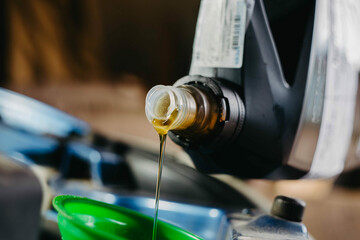 pouring new engine oil into the engine
