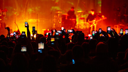 Hands with phones on concert, atmosphere on concert