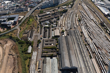 Cape Town, South Africa. 2022. Aerial view of trains and the railway tracks  in the south east district of Cape Town.