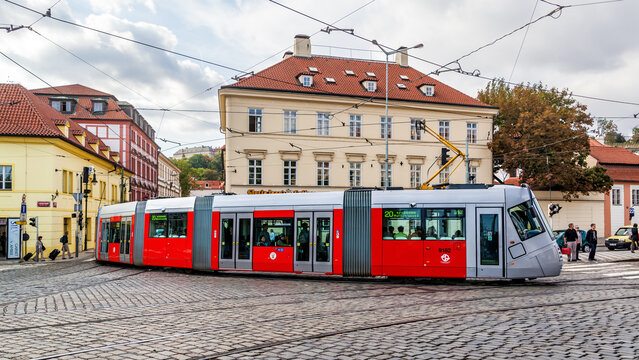 Long red tram in Prague