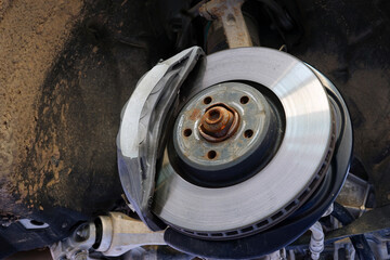 Details of the brake system of a modern car: brake disc and brake caliper installed on the car....