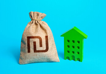 Israeli shekel money bag and green resident building. Investment in green technologies. Reduced emissions and improved energy efficiency. Reducing impact on environment. Sustainable housing. - obrazy, fototapety, plakaty