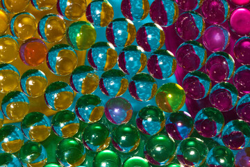 abstract futuristic colorful background of 3d glass beads dominated by blue, creative future design