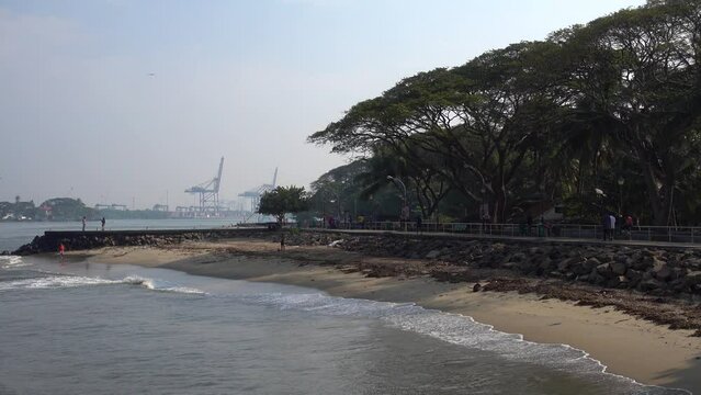 The sandy beach at Fort Kochi (Cochin) India.  Waves breaking