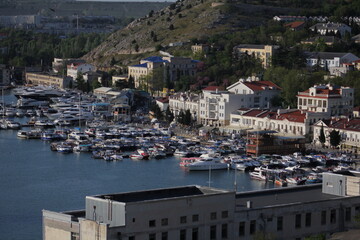 View from Mount Kastron, to the port in Balaklava Bay. In the Crimea, At sunset in May.
