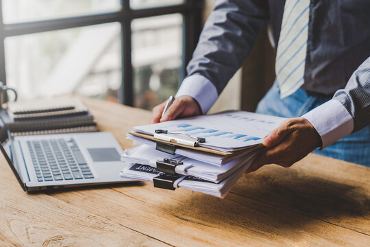 Businessman Putting Documents On The Table Gather Documents From The Meeting Business Reports, Important Documents