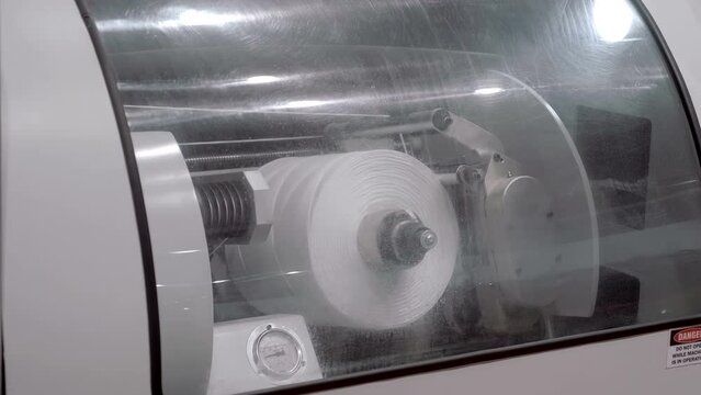 Modern industrial machine for the production and winding of nylon thread on bobbins