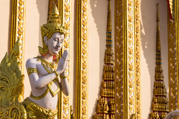 Bangkok, Thailand - April, 22, 2022 : Angel statue in temple at Bangkok, Thailand.