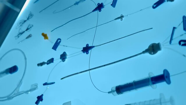 Set of instruments for central vein catheterization. Medical equipment - instruments for medical procedures for the treatment and prevention of human health. Close up. Shot in motion