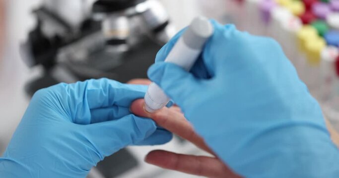 Doctor helps woman check her blood sugar levels with glucometer