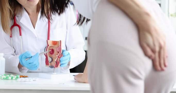 Woman with problem of constipation and hemorrhoids at doctor appointment