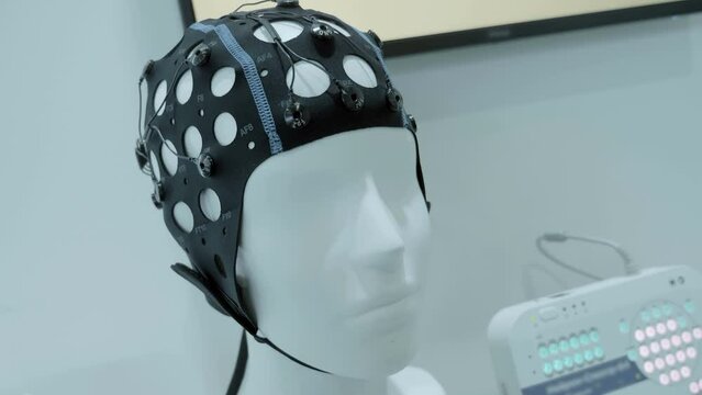 Medical, scientific registration equipment of electroencephalography from the human brain. A special cap with sensors of brain biorhythms and a device that fixes them and records these bioelectrical d