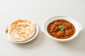 chicken tikka masala spicy curry meat food with roti or naan bread