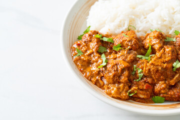 chicken tikka masala with rice on plate