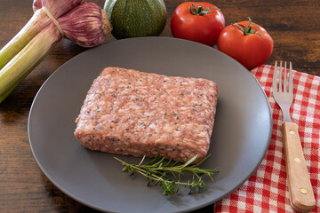 top view raw sausage meat with fresh vegetables
