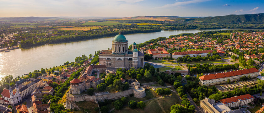 Esztergom, Hungary - Aerial panoramic view of Primatial Basilica of the Blessed Virgin Mary Assumed Into Heaven (Basilica of Esztergom) on a summer day with blue clouds and River Danube at background