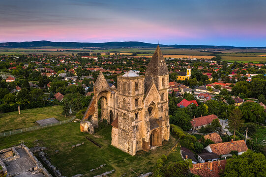 Zsambek, Hungary - Aerial view of the beautiful Premontre Monastery ruin church of Zsambek (Schambeck) with cemetery and ccolorful sky at background at summertime
