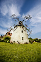Fototapeta na wymiar Old, wooden windmill from XIX century in a rural scenery south moravia, czech republic