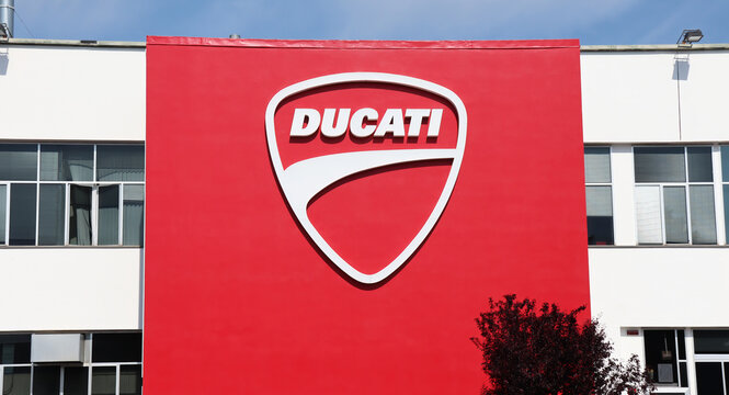 Bologna, Borgo Panigale - Italy - May 5, 2022: Headquarters of Ducati with big logo on the wall. Ducati is a famous Italian motorcycle manufacturing company. Bologna, Italy
