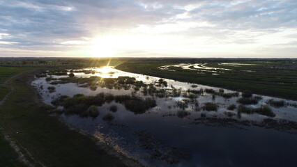 Naklejka na ściany i meble Aerial view of the swamp before sunset