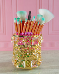 makeup brushes pink background