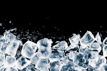 Ice cubes crush on black background. Chill backdrop.