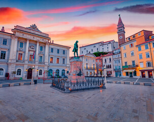 Stunning evening view of Tartini Square in old town of Piran. Berautiful summer sunset in Slovenia, Europe. Traveling concept background.