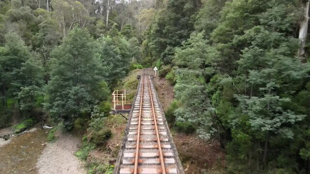 Flying along the Walhalla scenic steam railway tracks above the Thompson river in Gippsland.