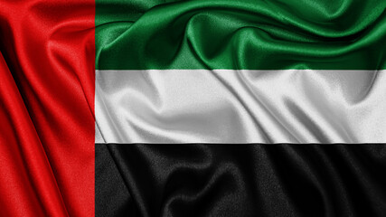 Close up realistic texture fabric textile silk satin flag of United Arab Emirates waving fluttering background. National symbol of the country. 2nd of December, Happy Day concept
