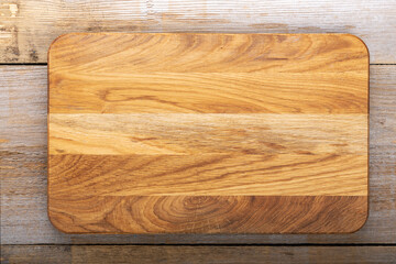 Chopping kitchen boards on a wooden background. Top view flat lay.