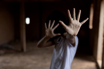 Kid girl showing hand signaling to stop useful to campaign against violence and pain. Stop abusing...