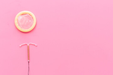 T-shaped intrauterine birth control device with condoms. Contraception concept