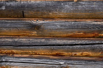 Horizontal wooden texture background from large logs. Brown boards with a natural pattern. 