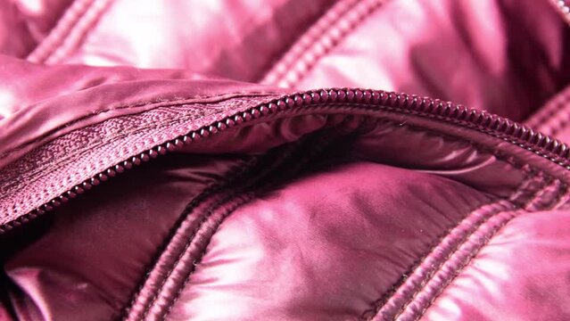 Detail of purple winter jacket, waterproof and windproof material, fabric cloth pattern
