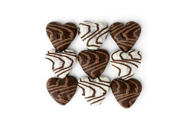 White and brown gingerbread cookies in heart shape isolated on white background.