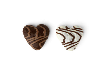 White and brown gingerbread cookies in heart shape isolated on white background.