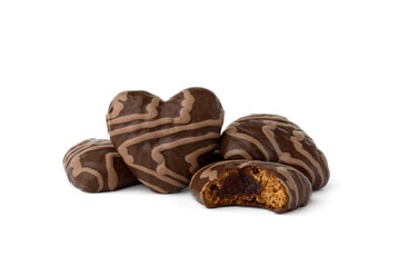 Gingerbread hearts covered chocolate glaze and with jam filling isolated on white background.