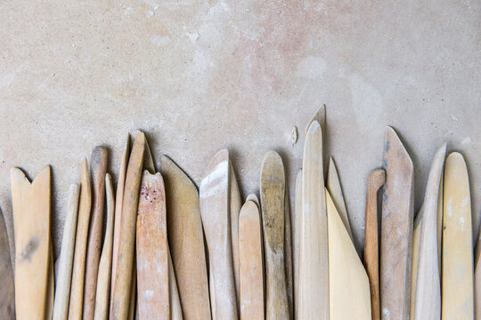 Wooden pottery tools set on a ceramics studio background - Powered by Adobe