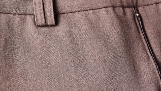 Pants closure, detail of the seam of the clothes

