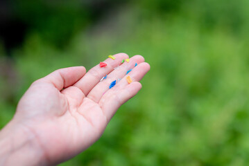 We found microplastics contaminating food. And we show off those microplastics in our hands.