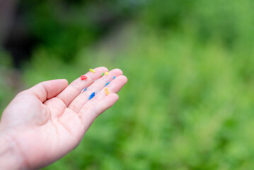 We found microplastics contaminating food. And we show off those microplastics in our hands.