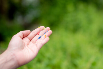 We found microplastics contaminating food. And we show off those microplastics in our hands.