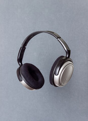 Headphones on a silver background. Minimal concept. Mock-up. Music. Levitation.