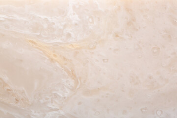 Background Stone wall, background with abstract stains of epoxy resin. Beautiful texture of marble and granite with stains, onyx surface. Finishing stone for furniture and interior. Acrylic stains