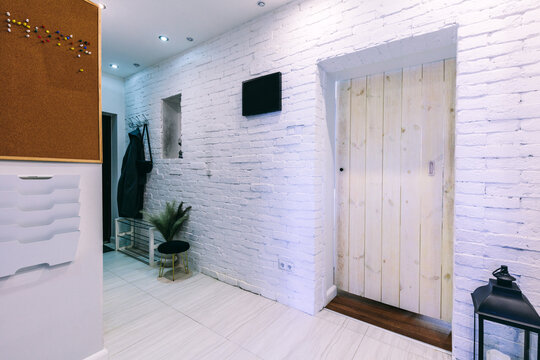 Corridor with retro wooden door in small apartment